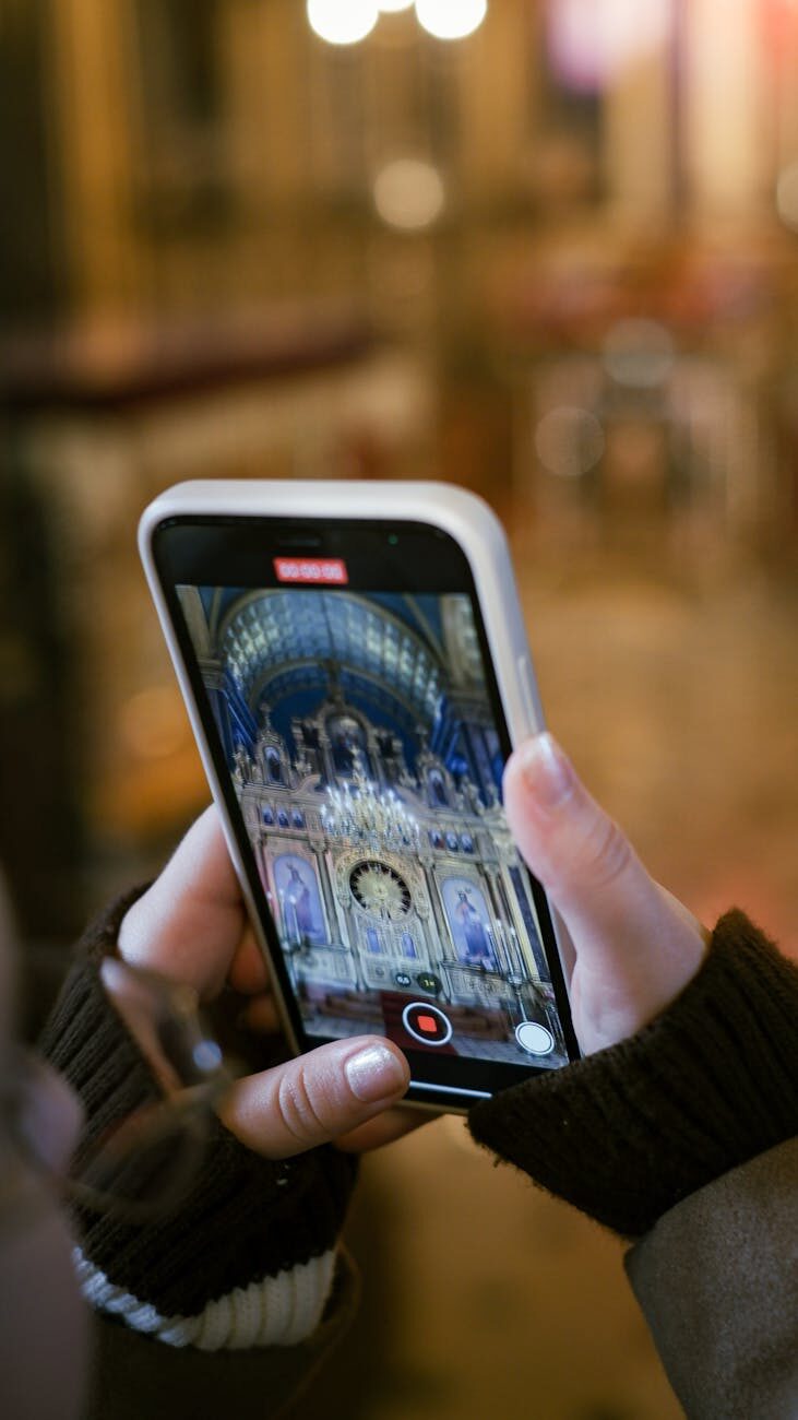 woman photographing altar with smartphone